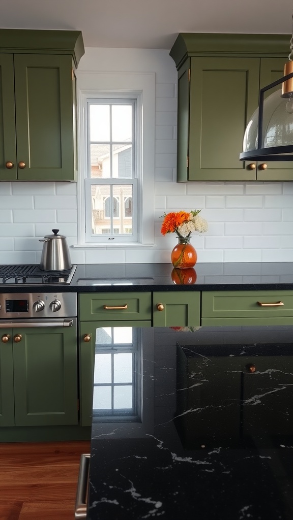 A kitchen featuring olive green cabinets and black countertops with gold hardware.