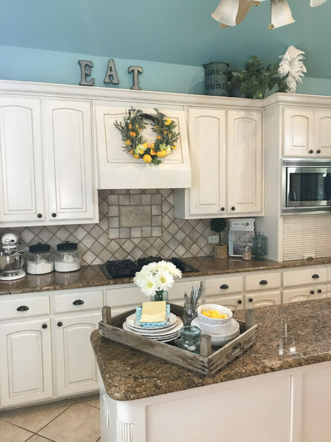22 Style Tips for Decorating the Space Above Kitchen Cabinets Like a Pro (Don't Miss #11!) - 5. Showcase Your Cookbooks