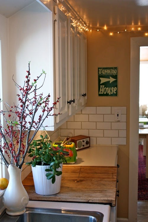 22 Style Tips for Decorating the Space Above Kitchen Cabinets Like a Pro (Don't Miss #11!) - 17. Create a Themed Display