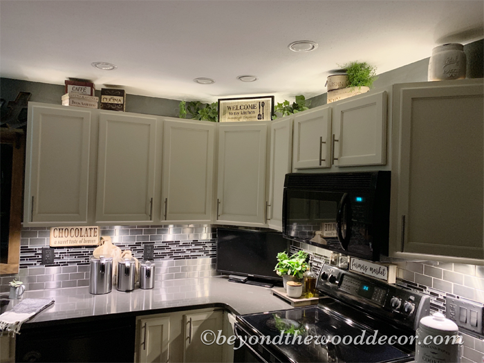 22 Style Tips for Decorating the Space Above Kitchen Cabinets Like a Pro (Don't Miss #11!) - 19. Incorporate Wall Art