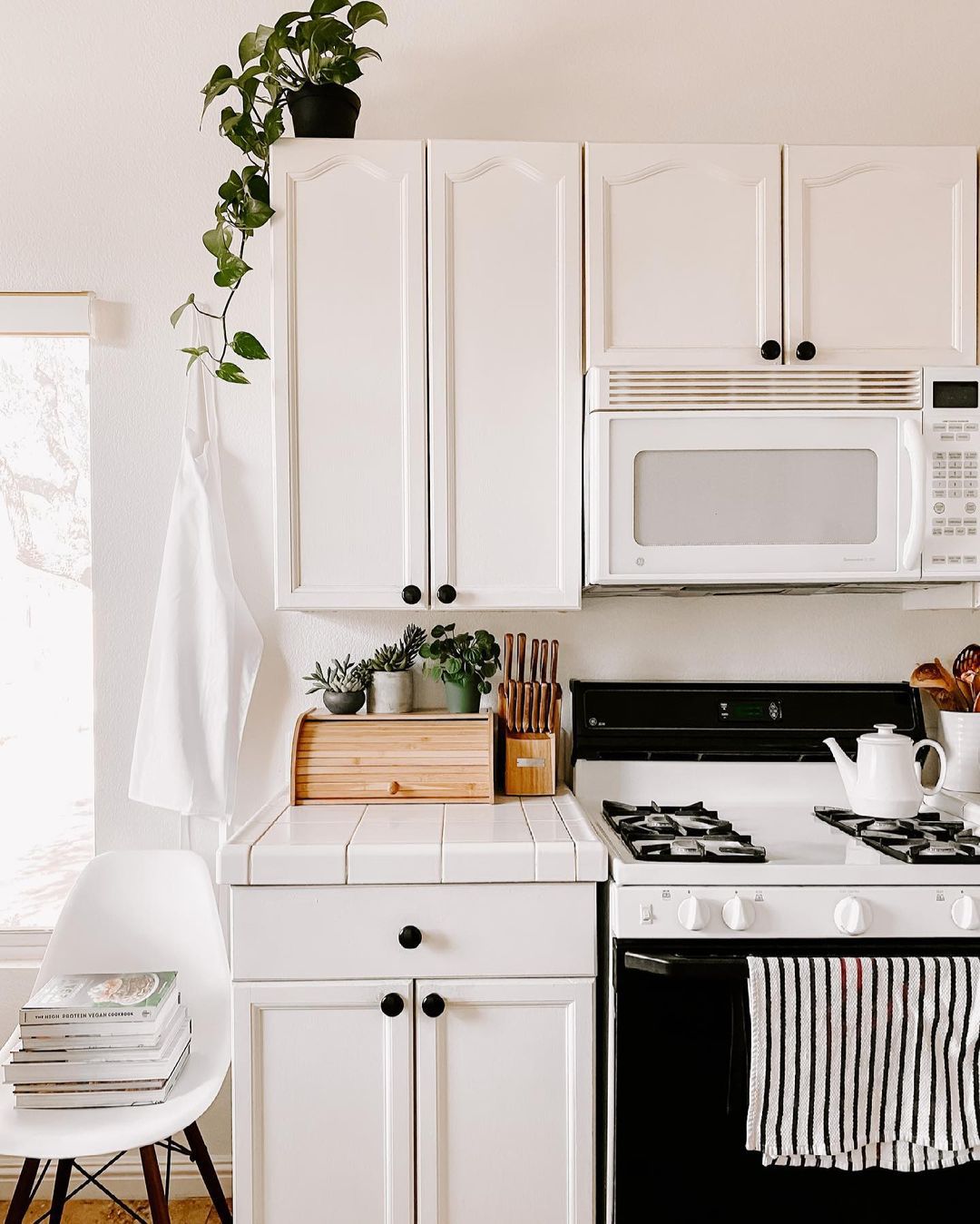 22 Style Tips for Decorating the Space Above Kitchen Cabinets Like a Pro (Don't Miss #11!) - 4. Use Decorative Baskets