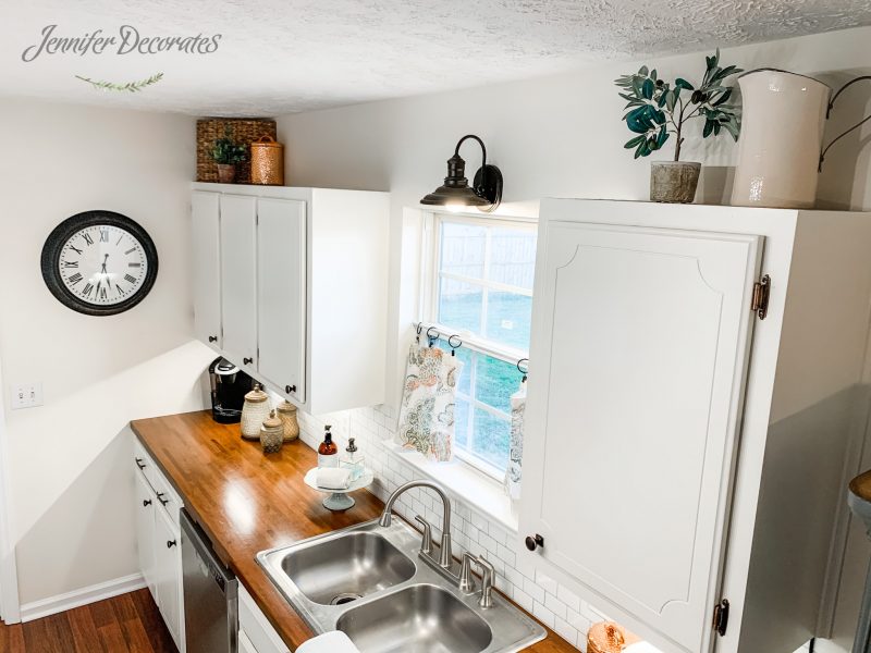 22 Style Tips for Decorating the Space Above Kitchen Cabinets Like a Pro (Don't Miss #11!) - 14. Incorporate Textiles
