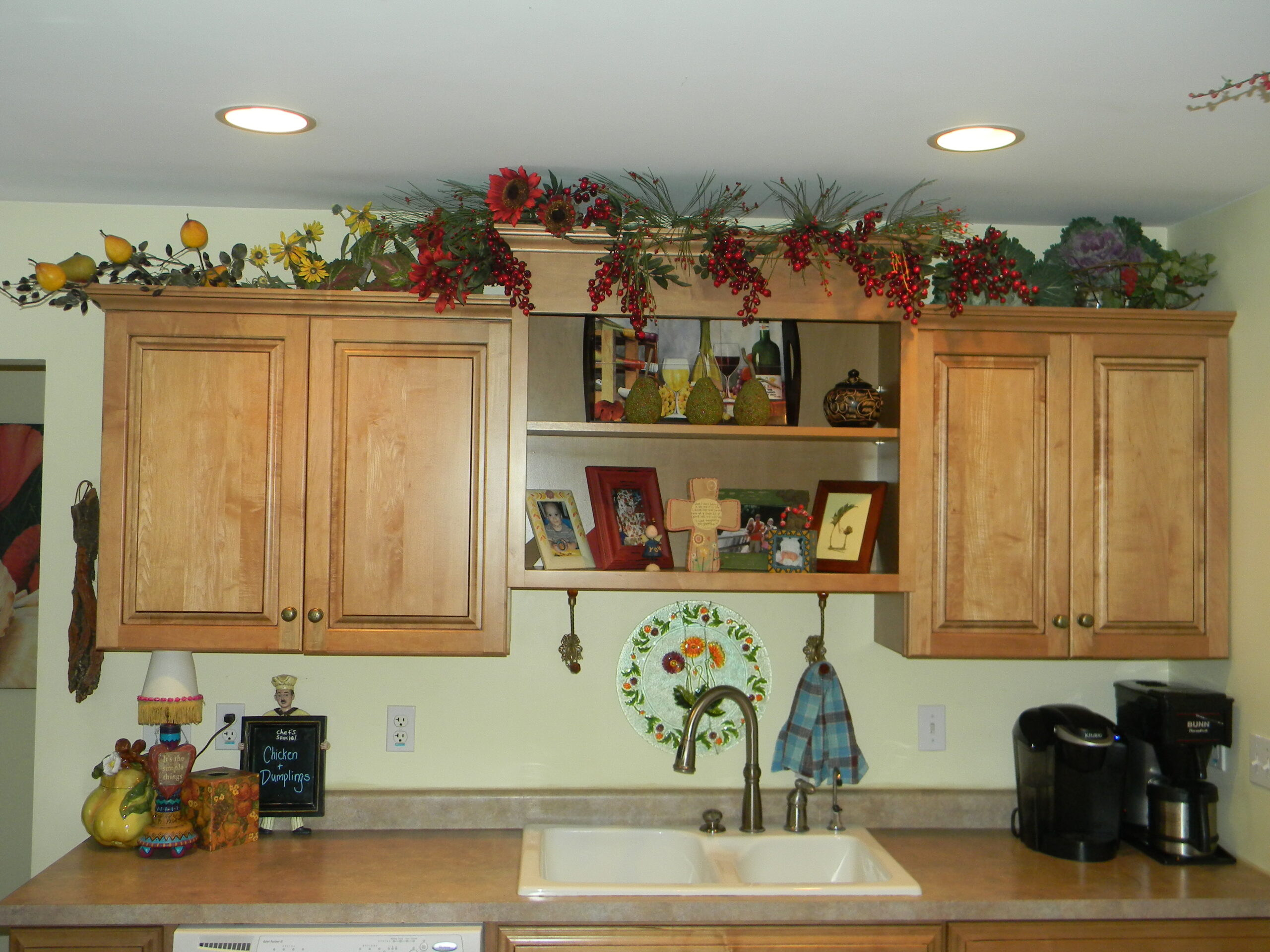 22 Style Tips for Decorating the Space Above Kitchen Cabinets Like a Pro (Don't Miss #11!) - 12. Showcase Family Heirlooms